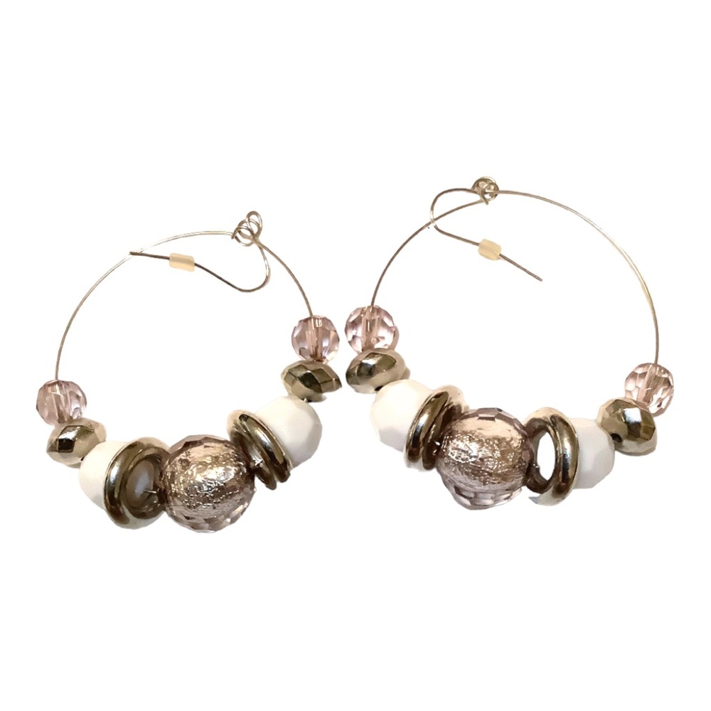 Silver toned large hoop earrings with individual clear, white, and silver beads